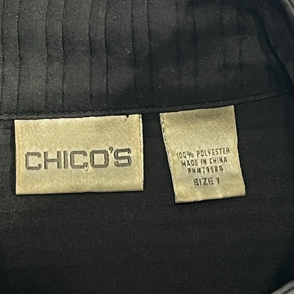 Chico's Vest Size 1 Zip up front pockets on front Black With White Stitching‎